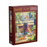 Jigsaw puzzle box with a bakery scene on a wooden surface