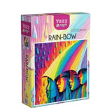 Yazz rainbow-themed puzzle box on a wooden surface with a light background