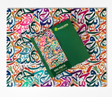 A 500-piece jigsaw puzzle by Puzzlers, featuring a vibrant multicolor abstract swirl pattern, shown with its dark green box on a matching patterned background.