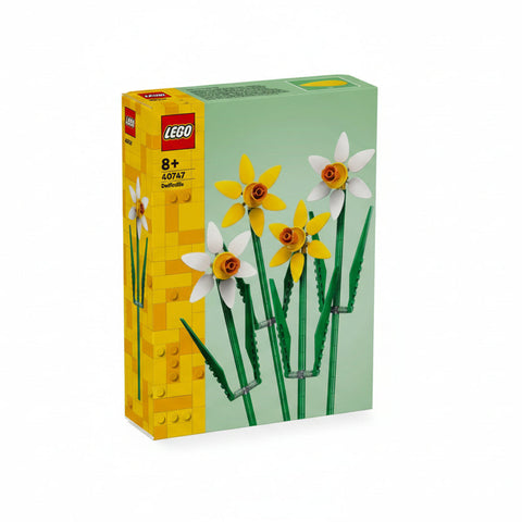 LEGO set packaging with daffodil flowers on a light green background