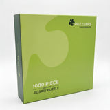 A green 1000-piece jigsaw puzzle box by Puzzlers, shown at a three-quarter angle on a light gray background.