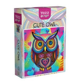Colorful packaging of Yuzz Cute Owl product on a white background